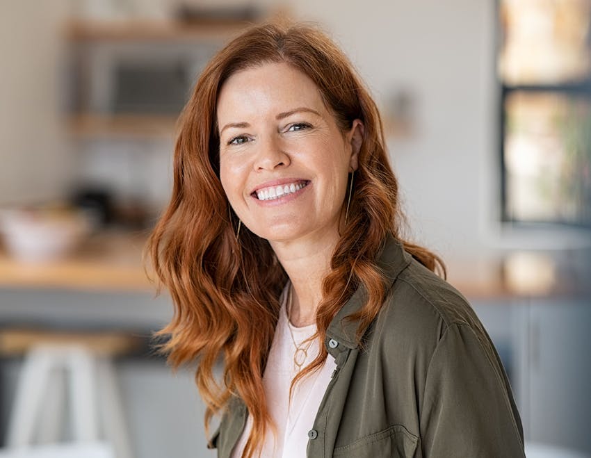 red haired woman smiling