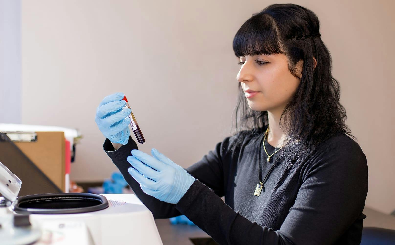 Lab technician holding a blood sample