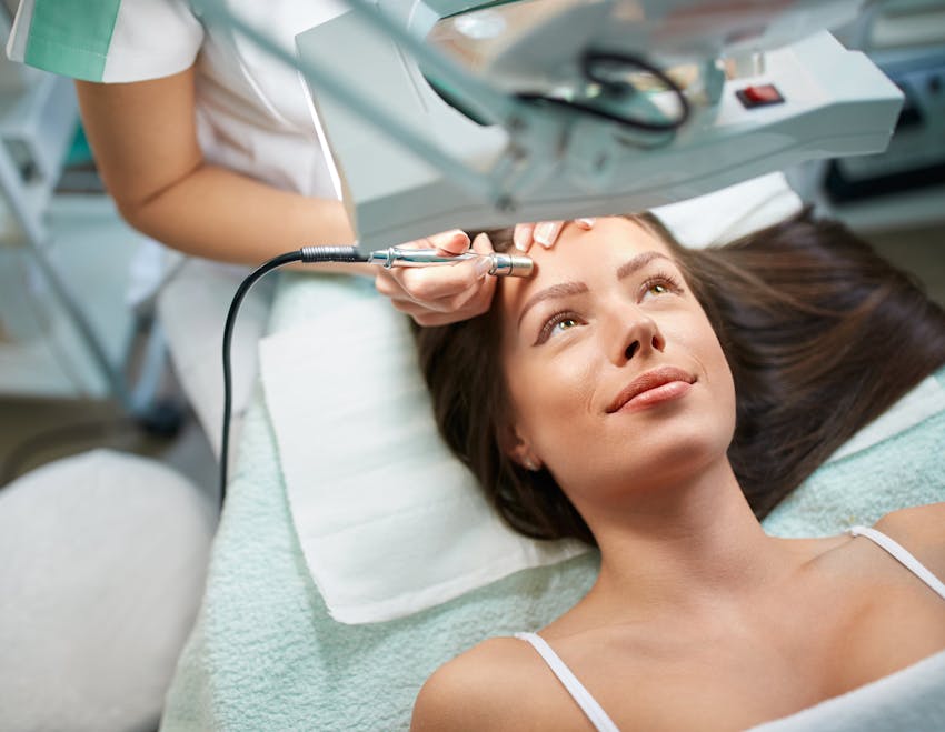 woman undergoing laser treatment