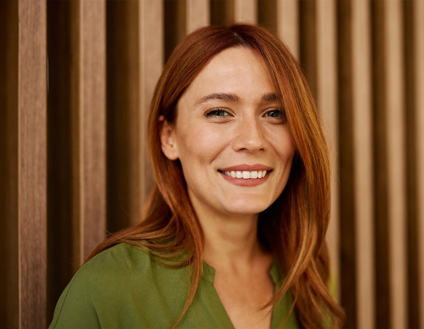 red haired woman smiling