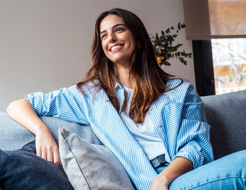woman smiling on couch