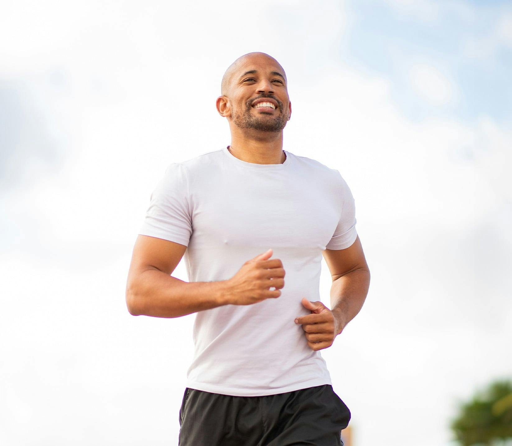 man running and smiling
