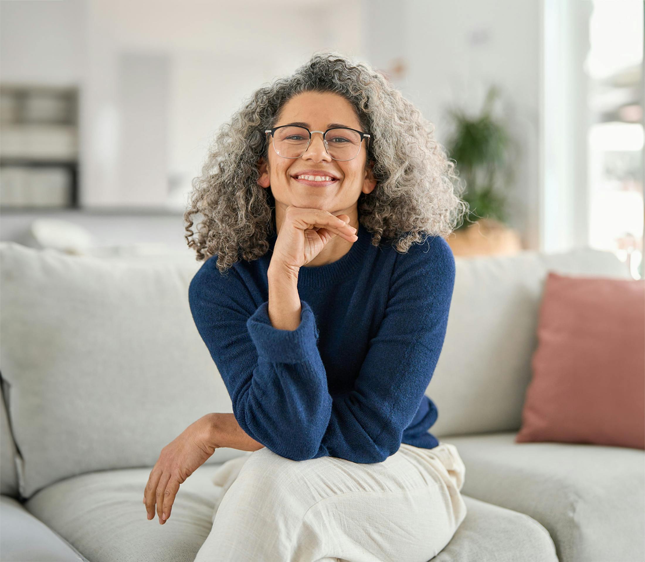 woman on couch smiling
