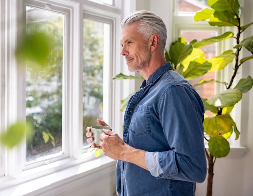 man drinking a cup of coffee