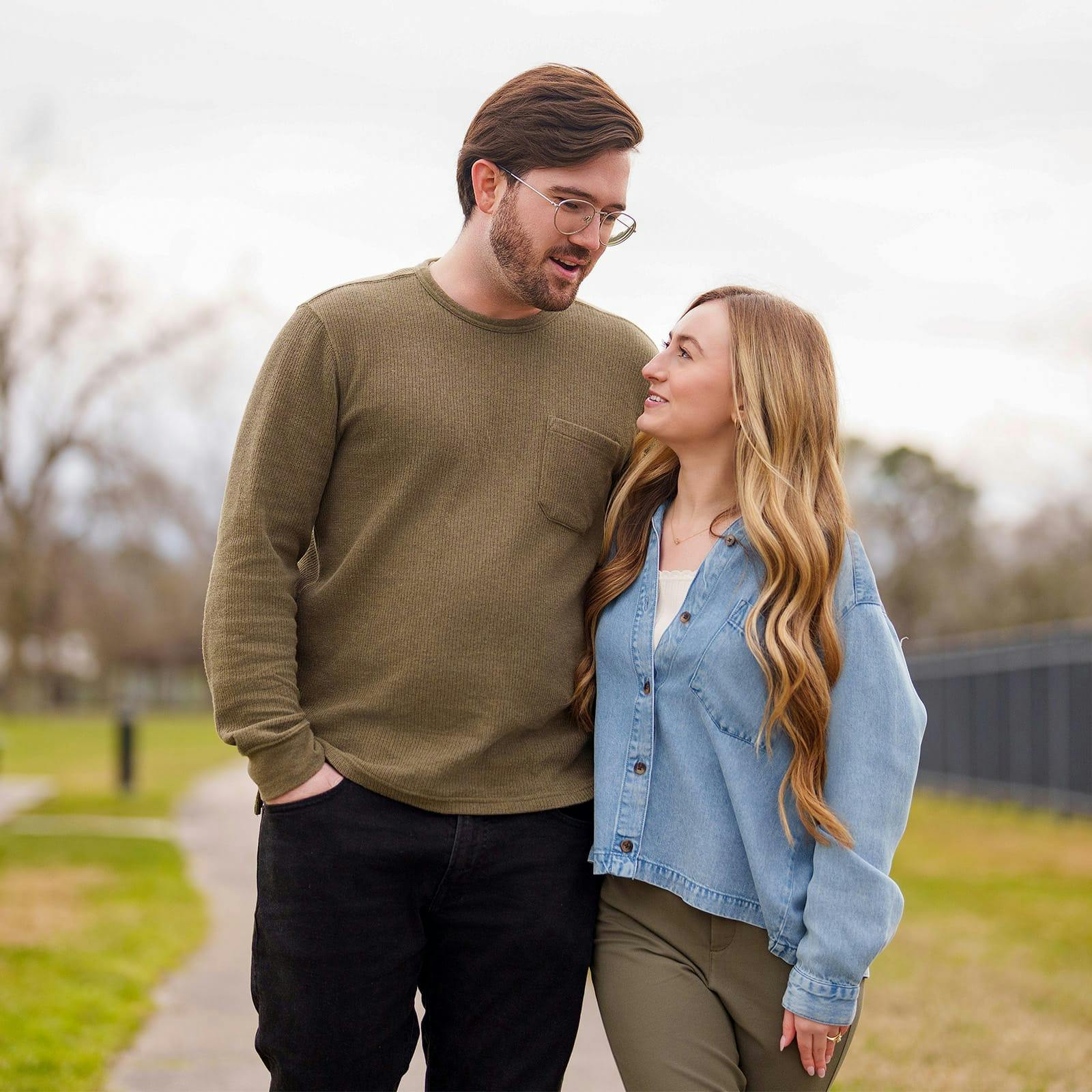 man and woman side hugging