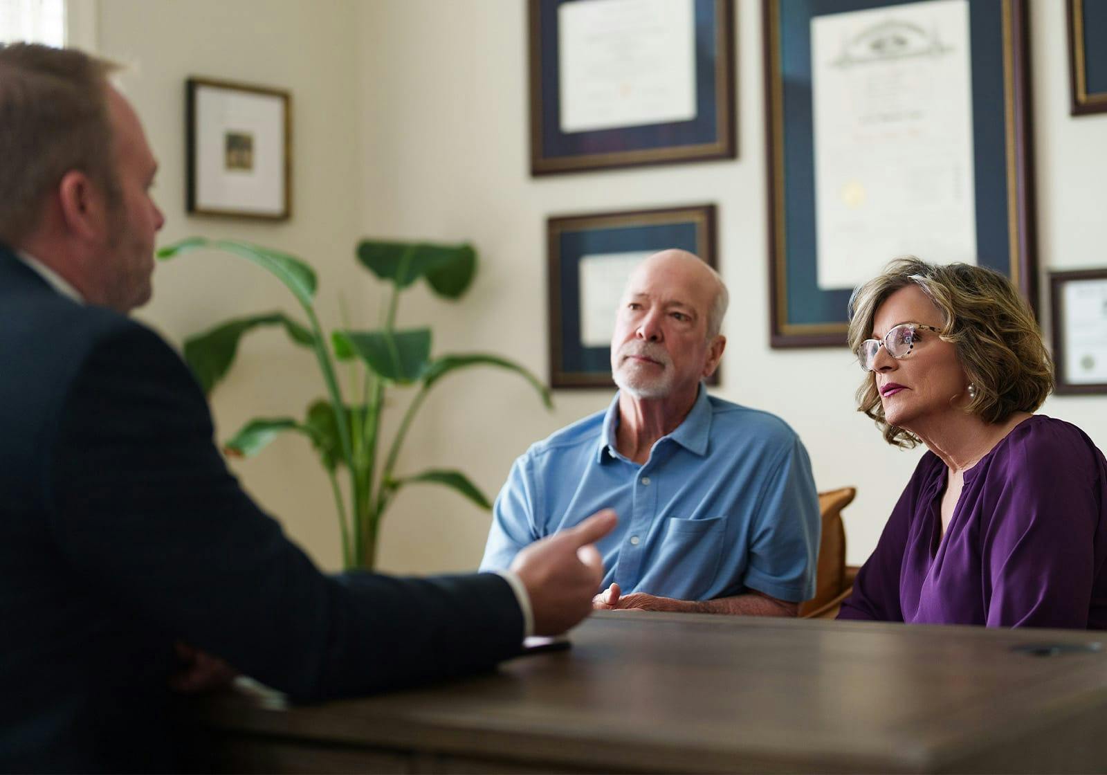 attorney talking to two clients