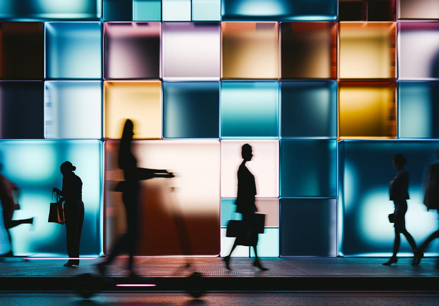 blurry image of people in a crosswalk