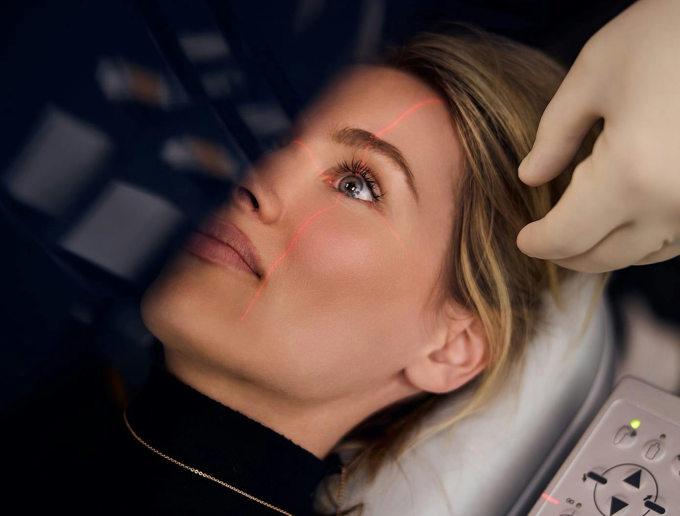 Woman getting laser procedure on her eye