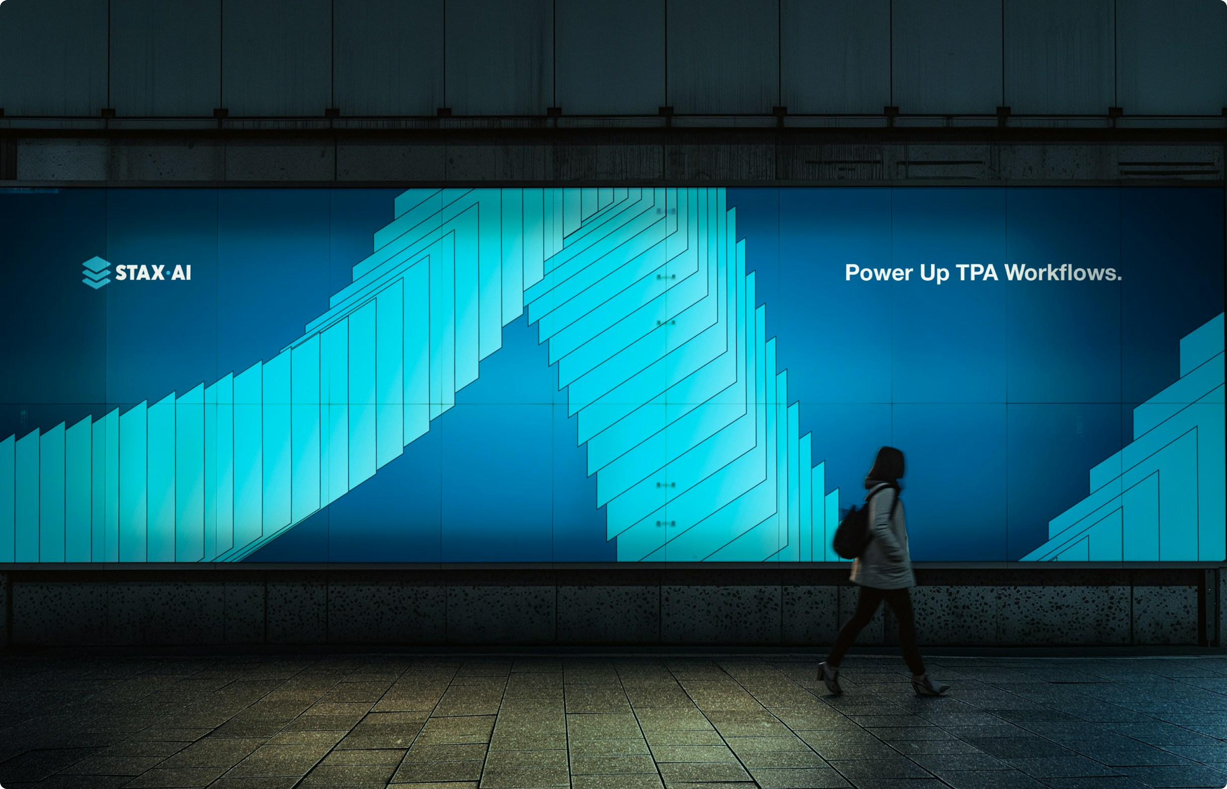 Large-scale mural featuring Stax.ai’s abstract wave form and brand tagline.