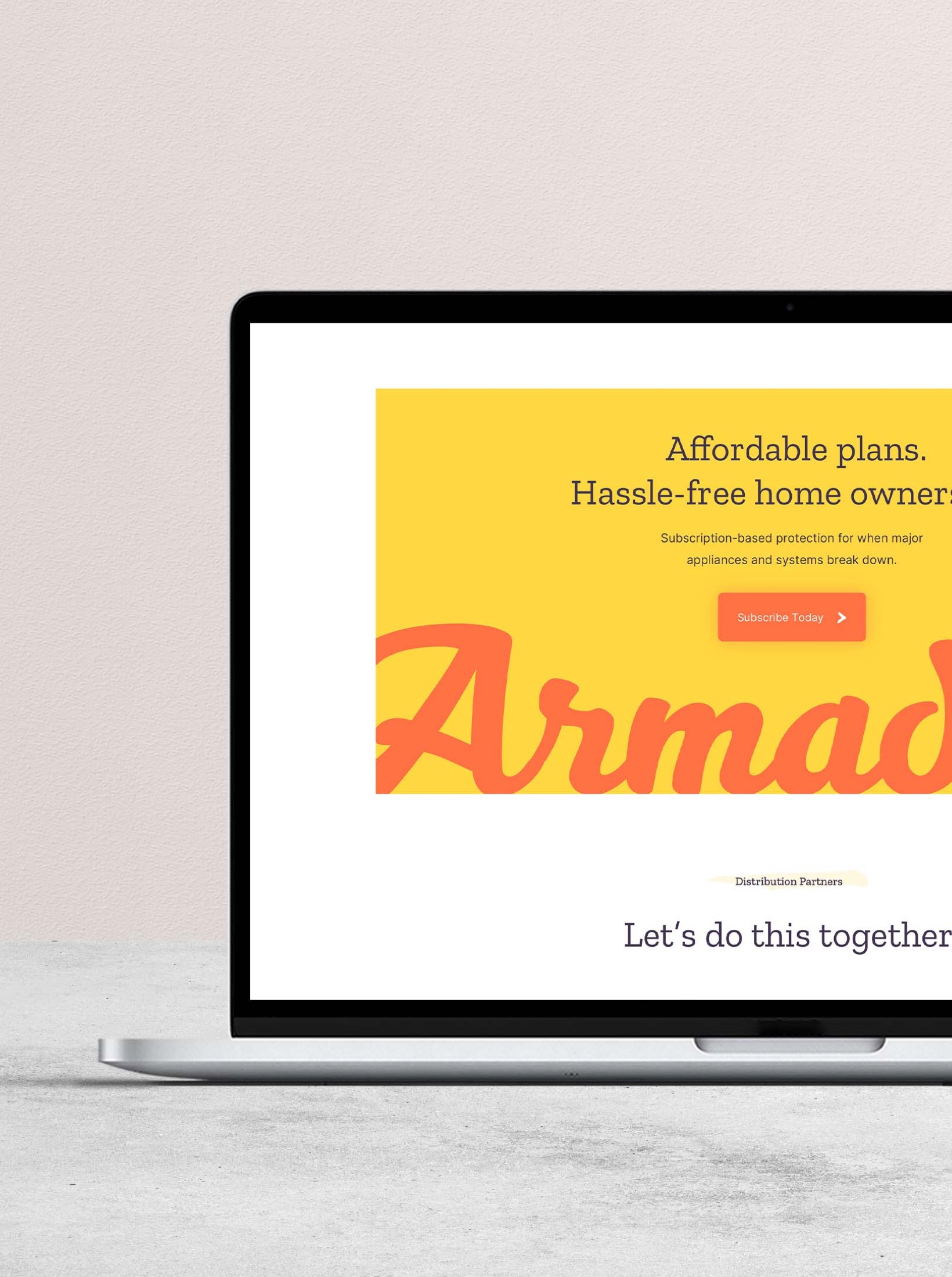 Laptop mockup displaying Armadillo website with orange brand accents.
