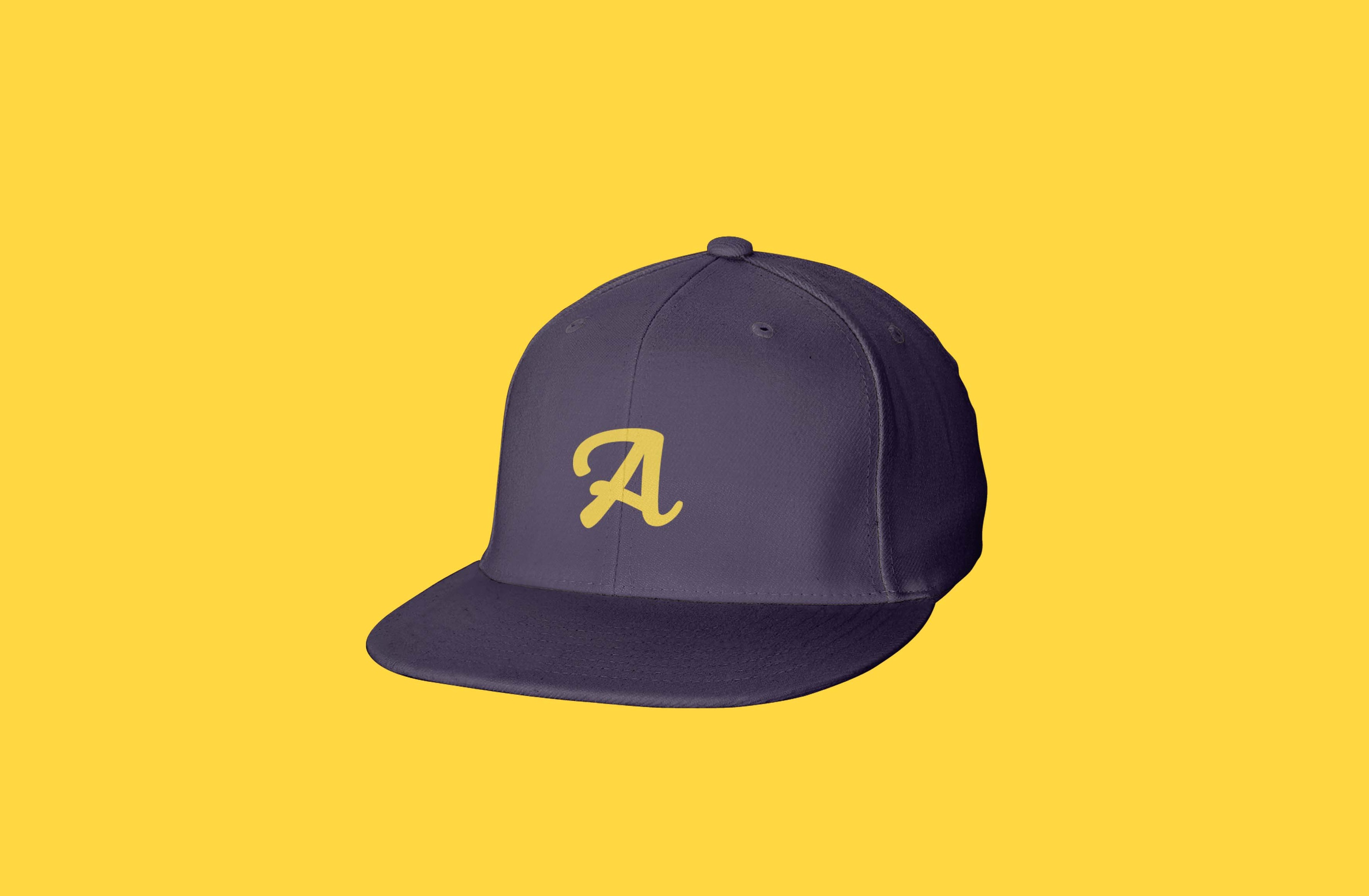 Navy baseball cap featuring yellow Armadillo embroidered logo.