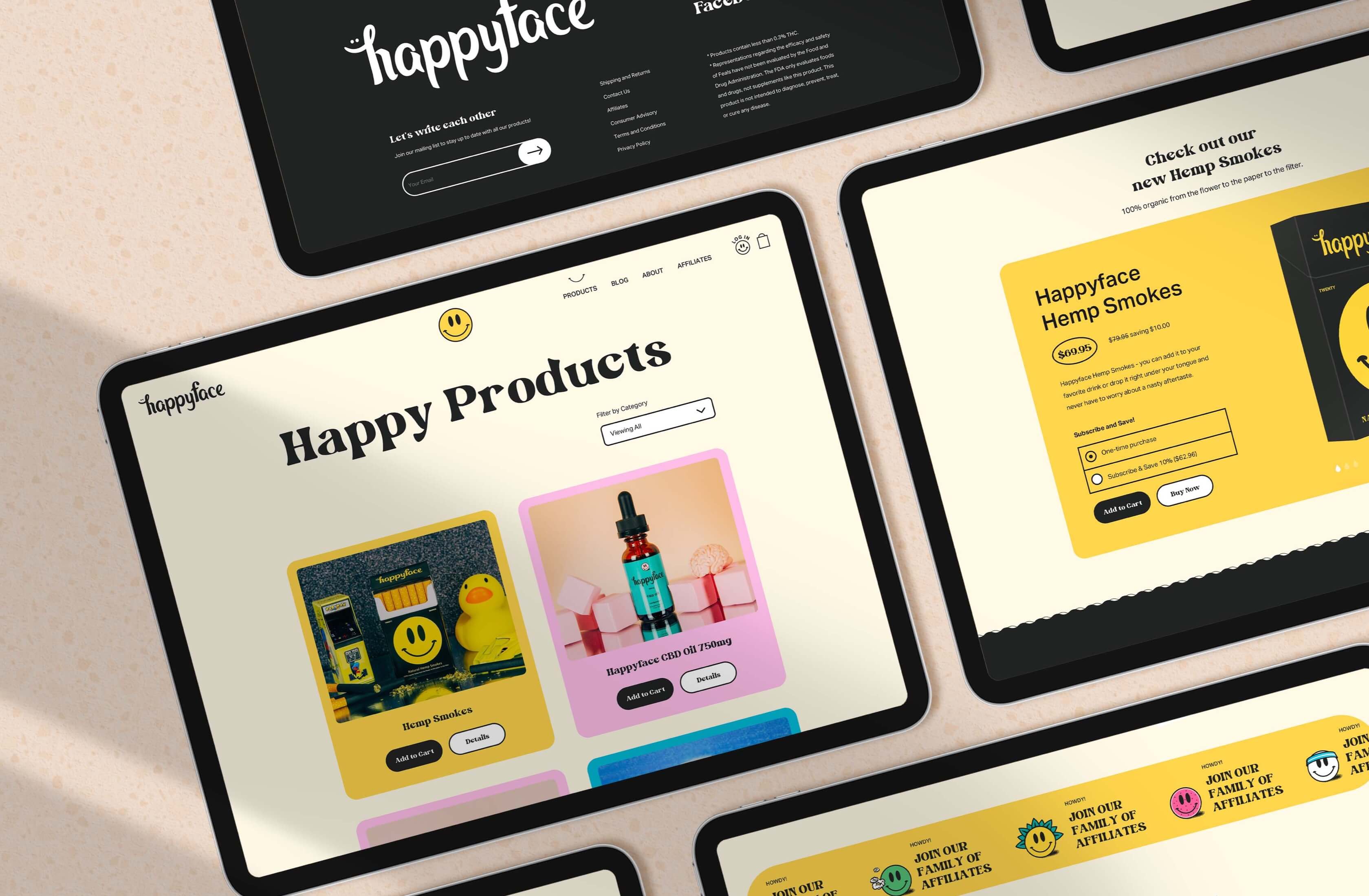 Tablet displaying Happy Face website next to packaging and stationery.