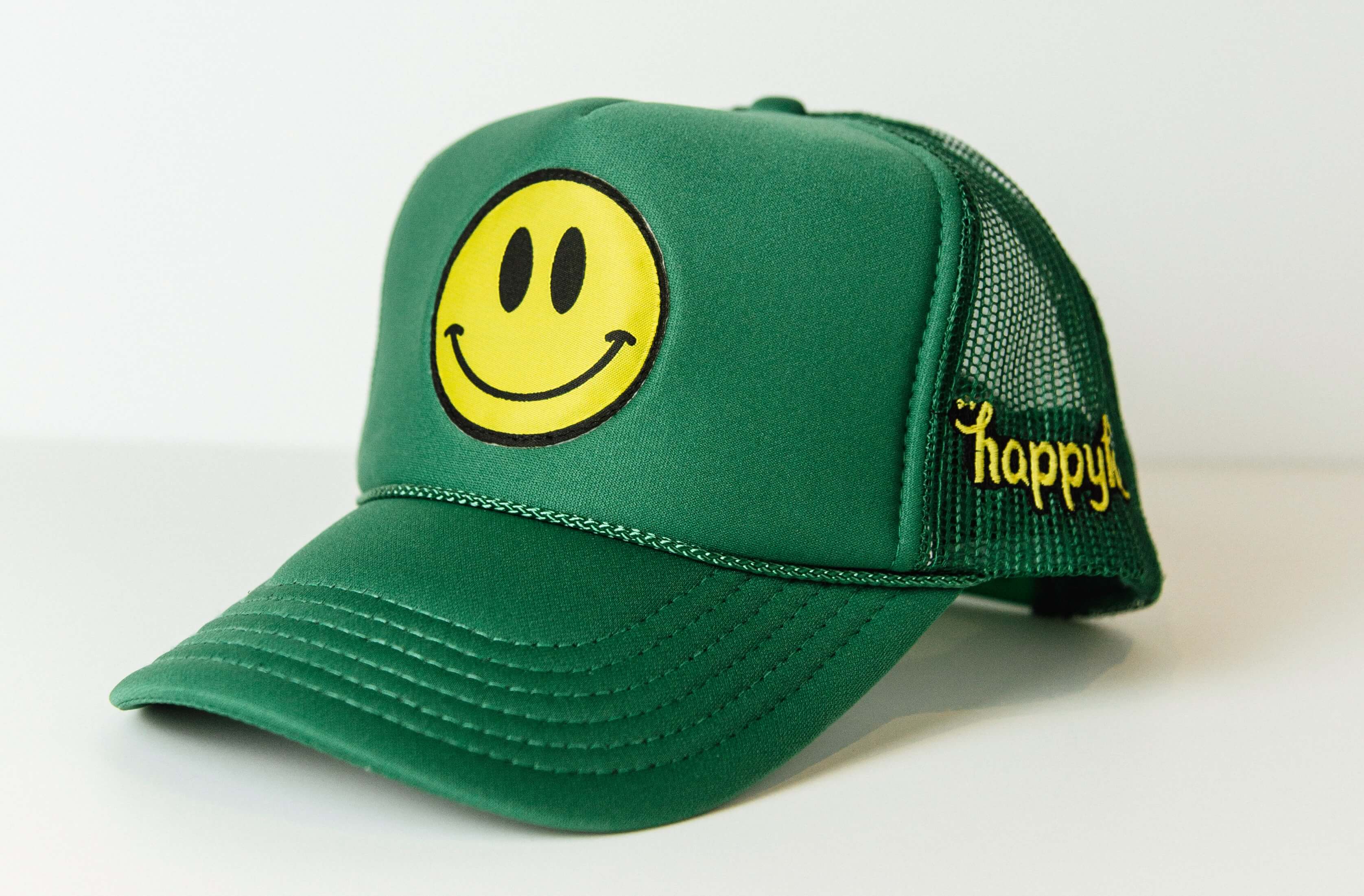Green Happy Face baseball cap with embroidered smile logo.