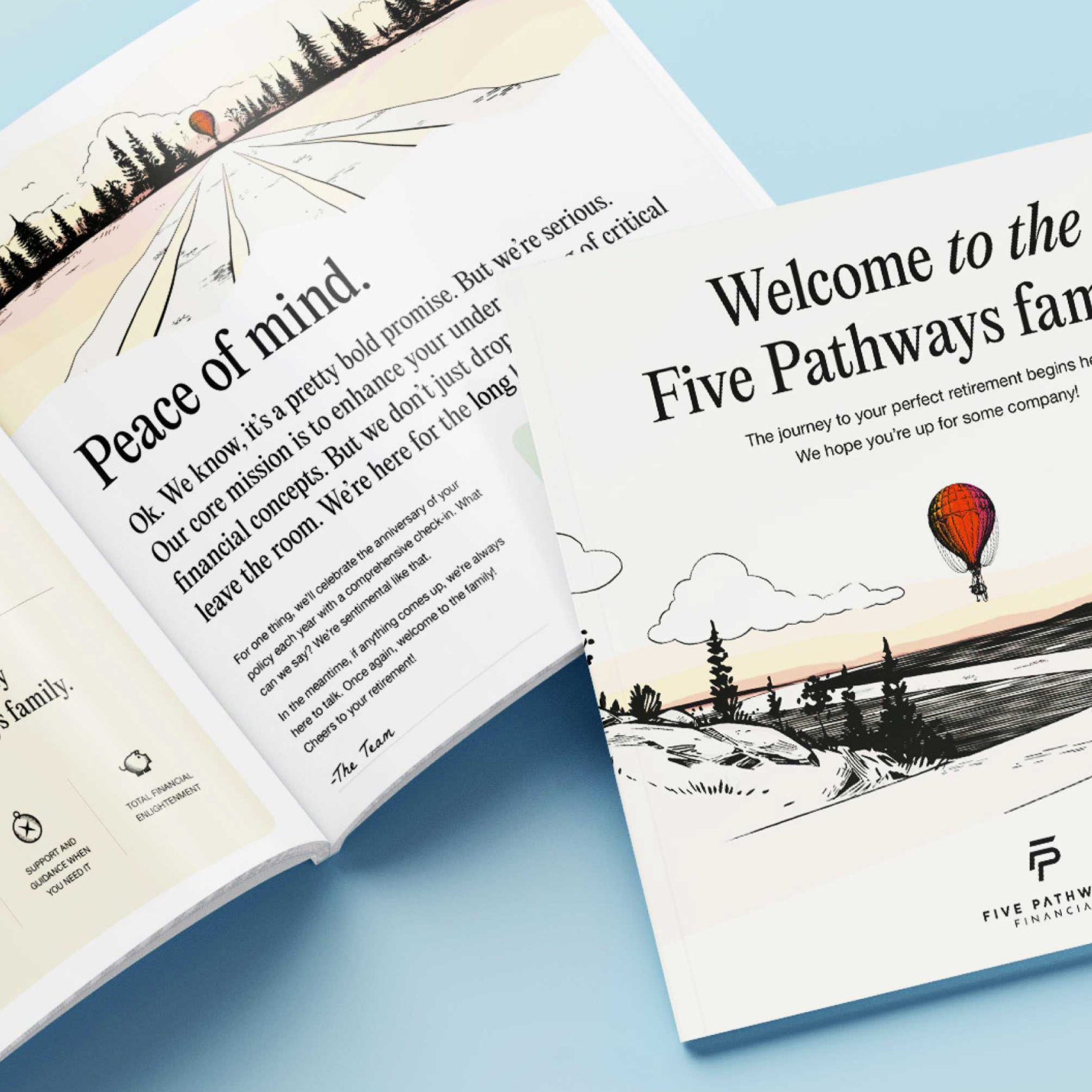 Set of printed marketing materials spread across a desk surface.