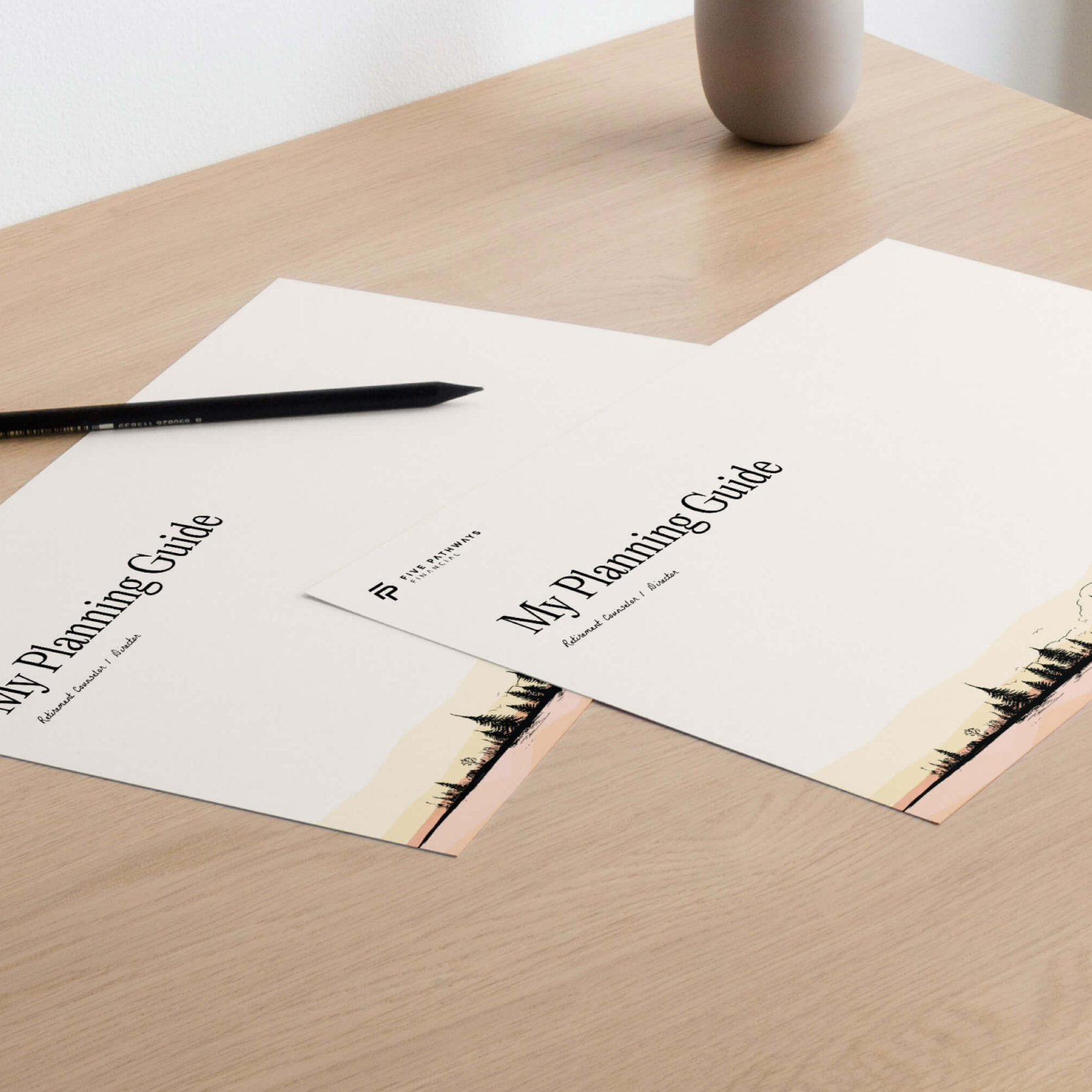 Stationery layout including envelopes and letterhead arranged on a desk.