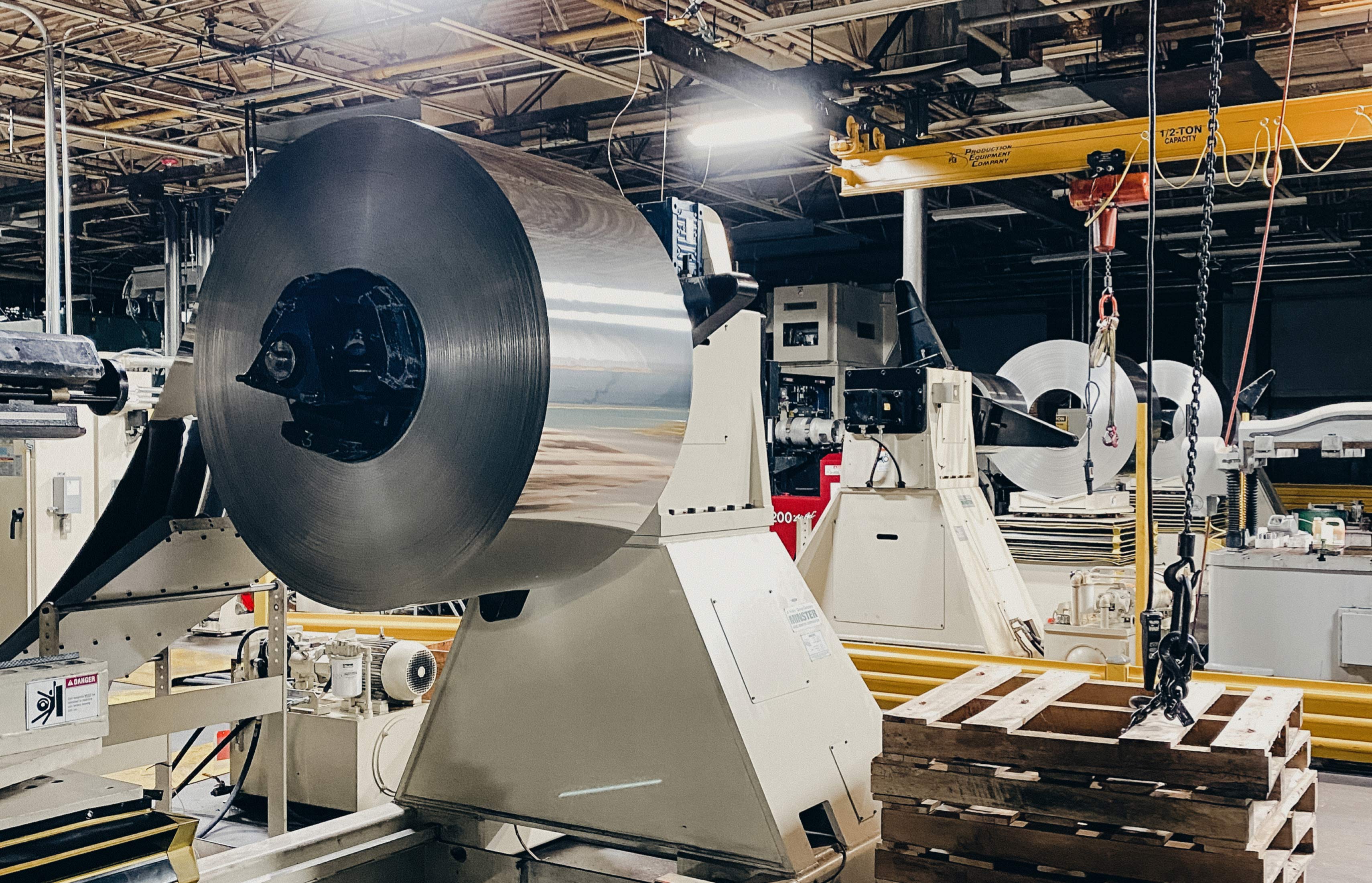 Cly-Del machinery workstation with large-scale industrial equipment.