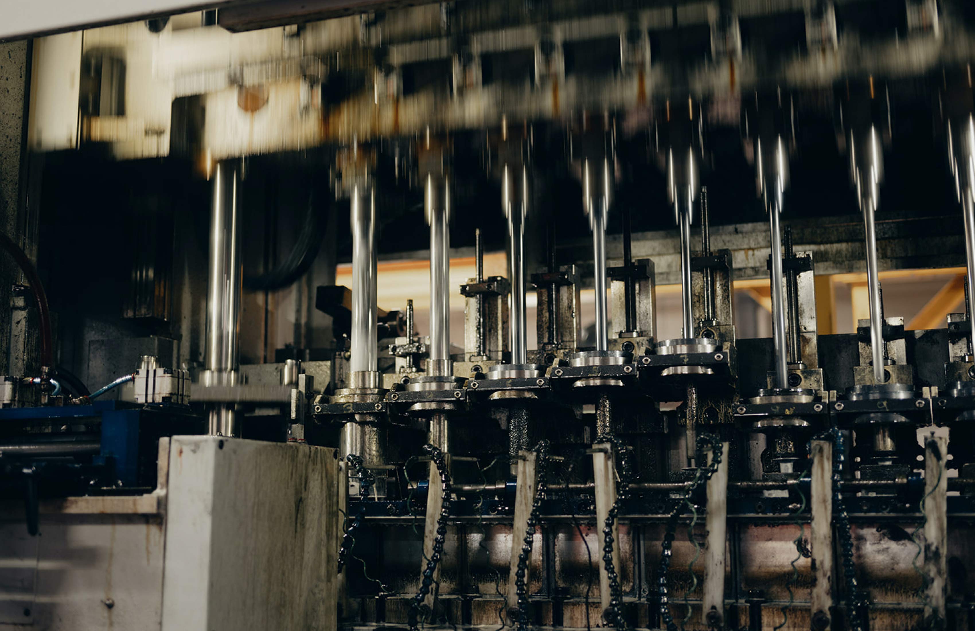 Row of industrial manufacturing machines inside the Cly-Del facility.