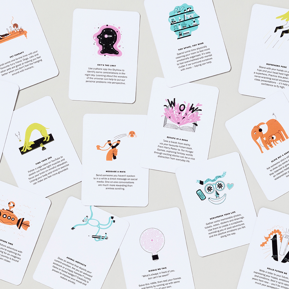 Platfform Positive Power-Up cards scattered on light grey surface with colourful illustrations and explanatory text