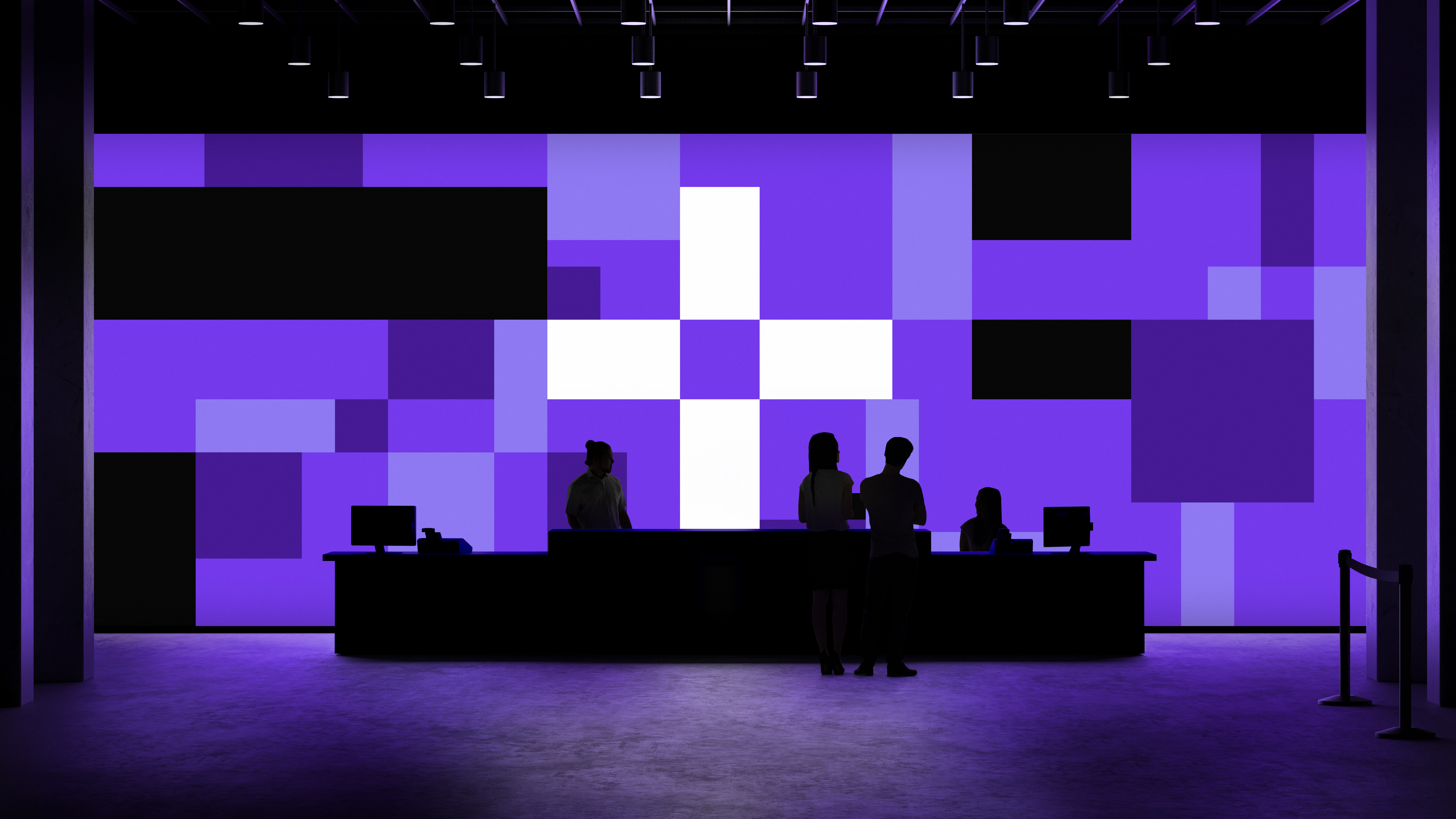 Reception area in dark exhibition with silhouetted people and desk before large purple screen showing pixel design in purple, black and white
