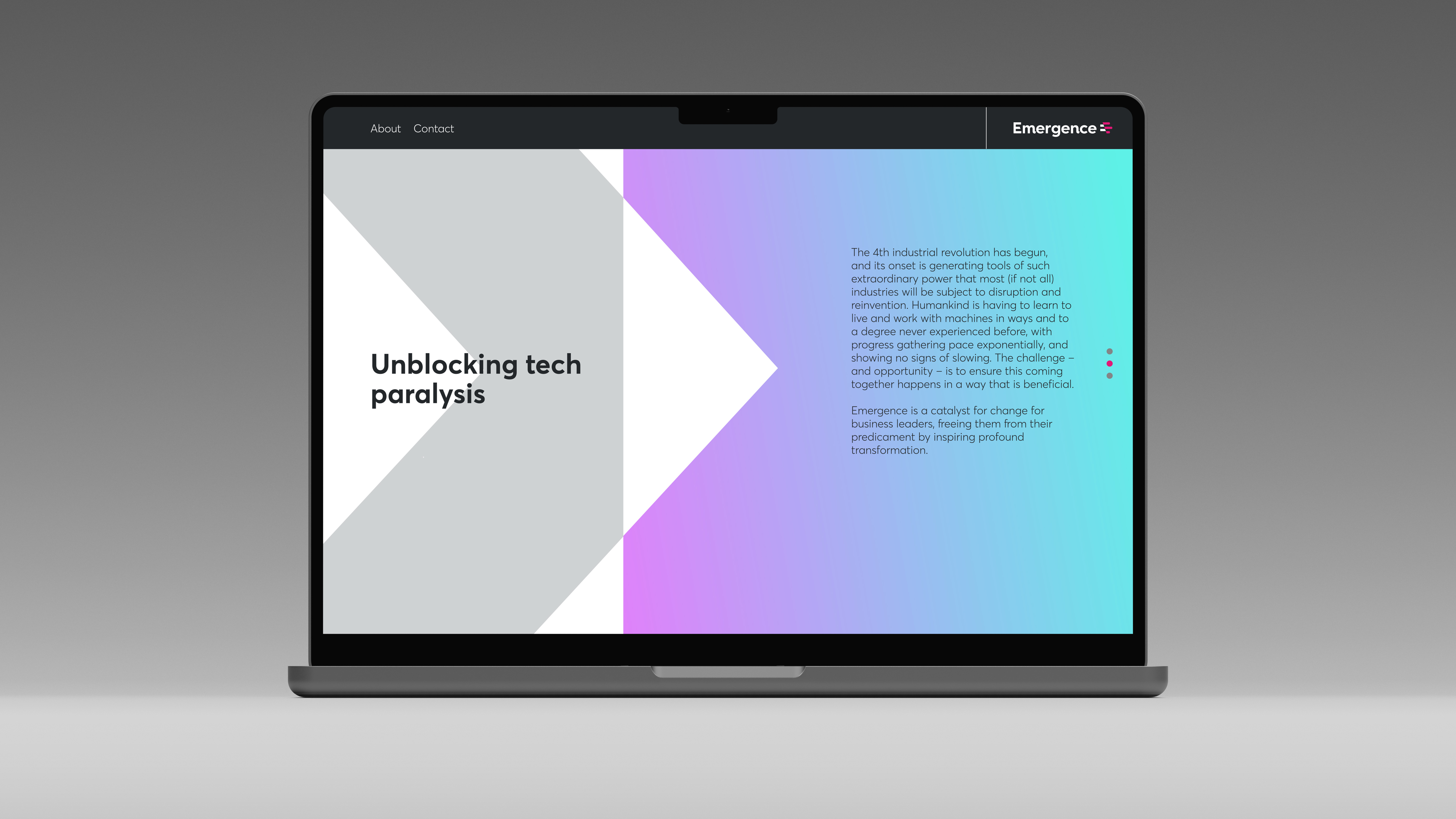 Laptop on grey surface showing Emergence webpage with abstract grey and purple-blue shapes and message on unblocking tech paralysis