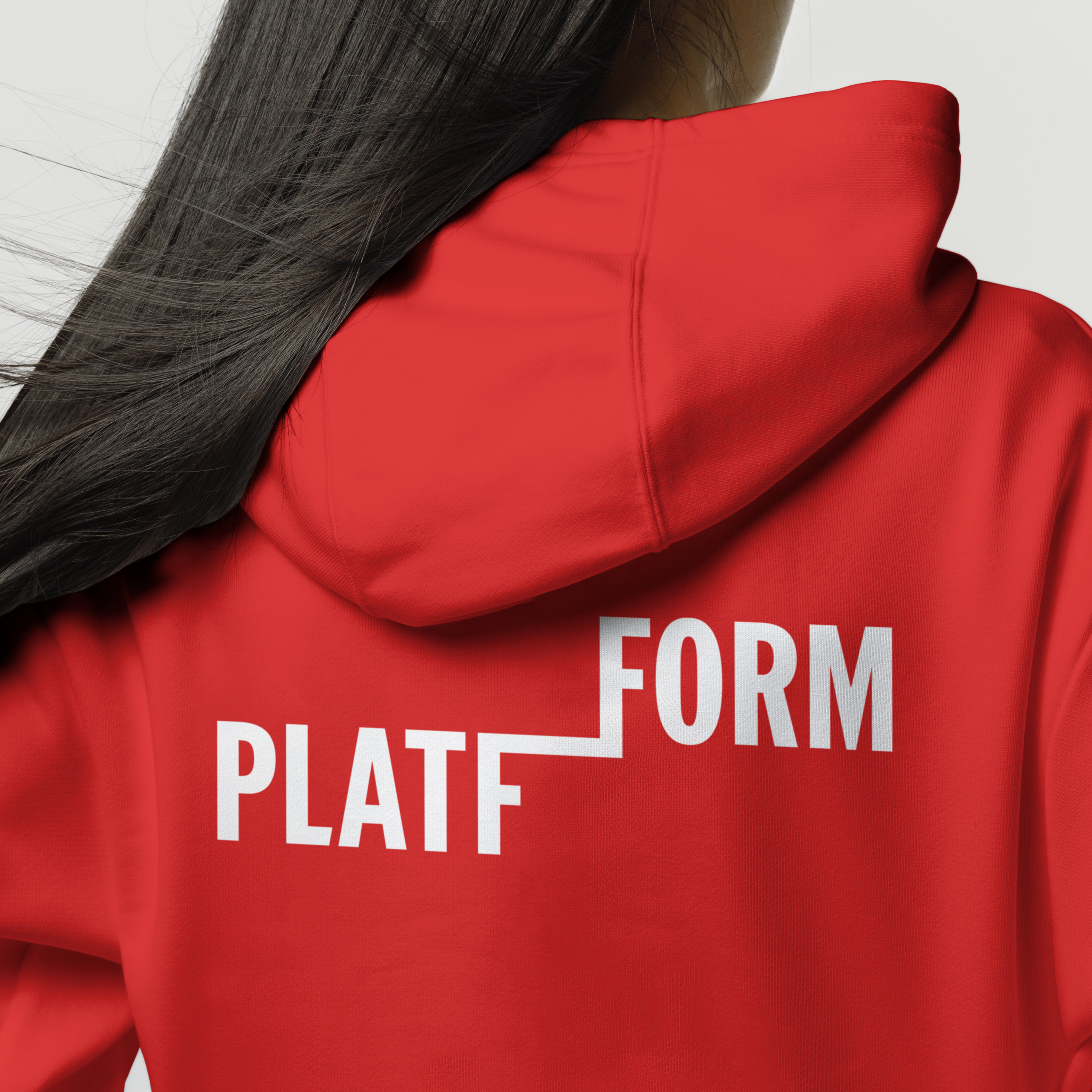 Back view of person wearing a red hoodie with a bold white 'PLATFFORM' logo