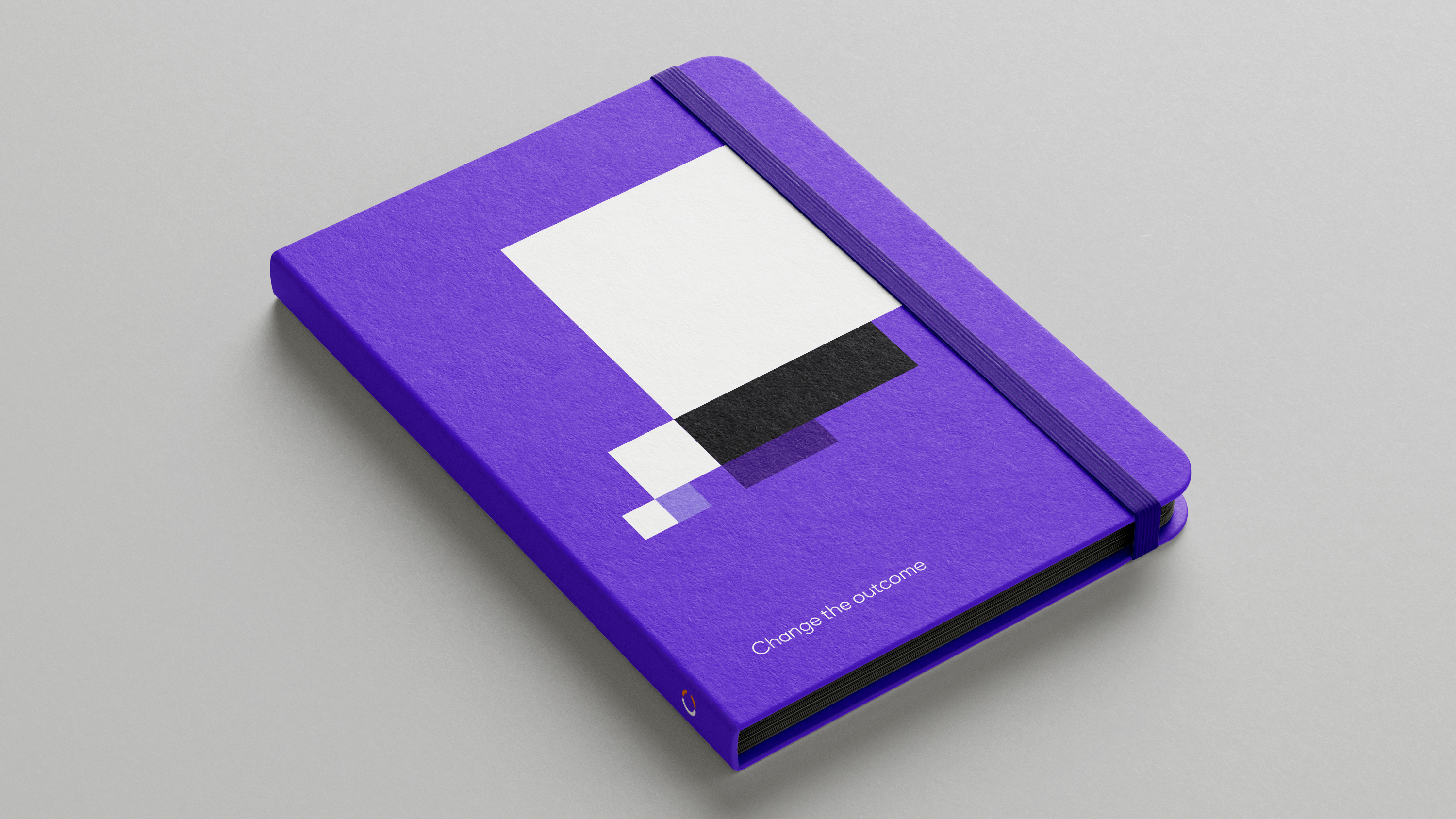 Purple notebook on light grey surface featuring white, black and purple pixel block thought bubble and ‘Change the outcome’ text