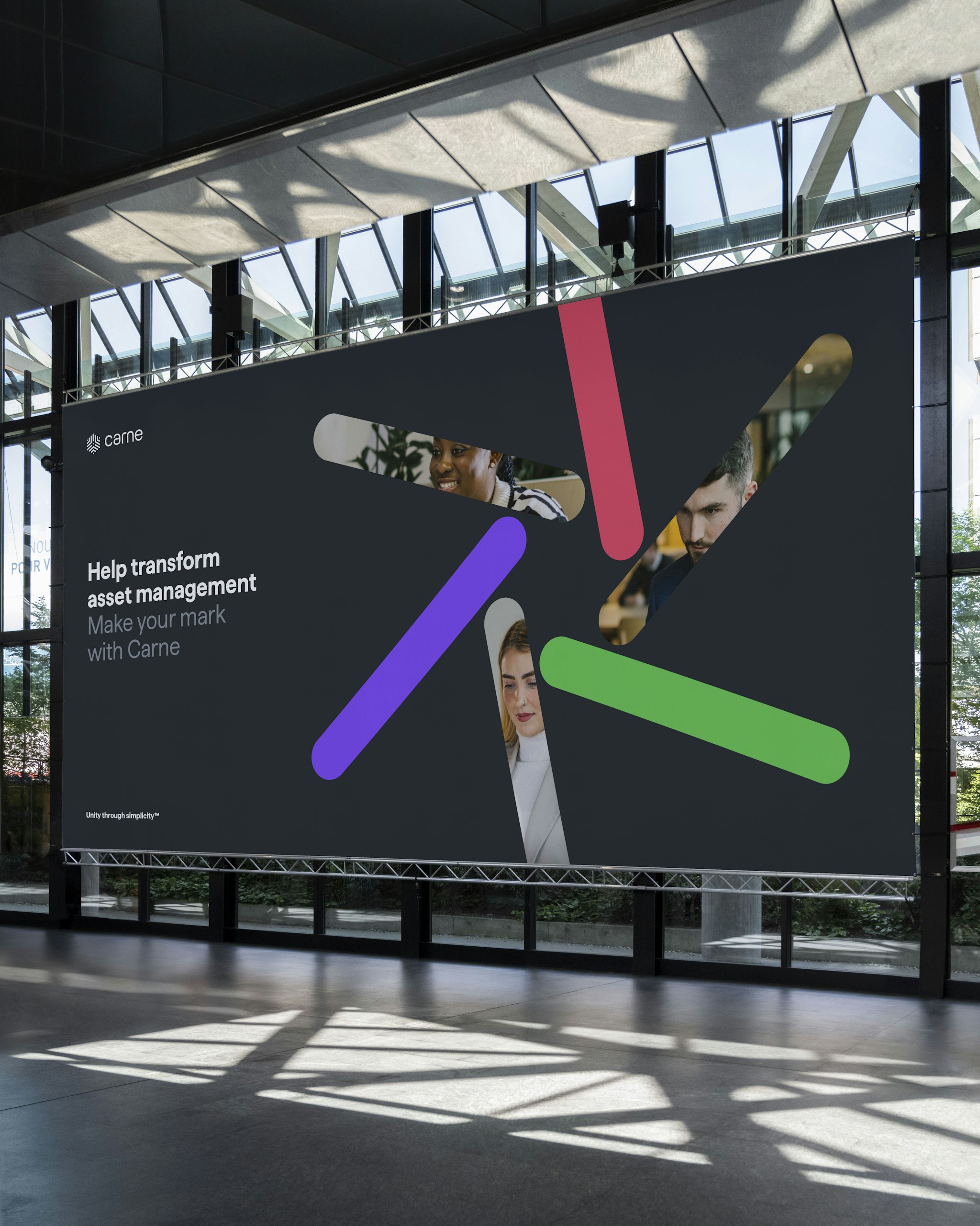 Carne Group event banner with the message ‘Help transform asset management – Make your mark with Carne’ in a modern event space.