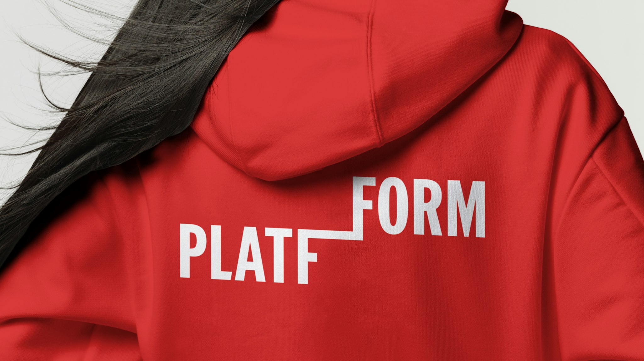 Back view of person wearing a red hoodie with a bold white 'PLATFFORM' logo.