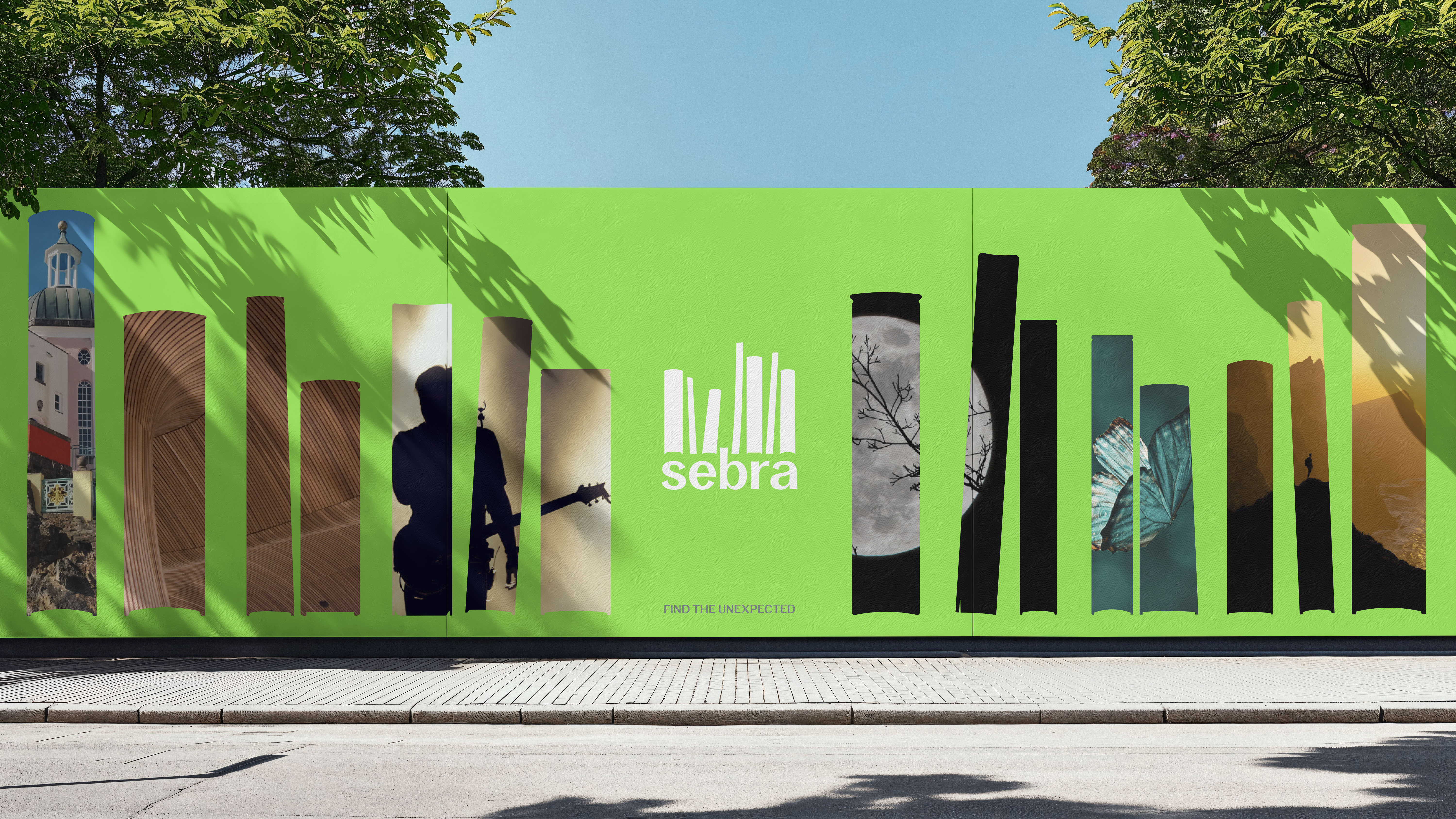 Outdoor hoarding with book spine-shaped apertures filled with atmospheric imagery and white Sebra logo on bright green background