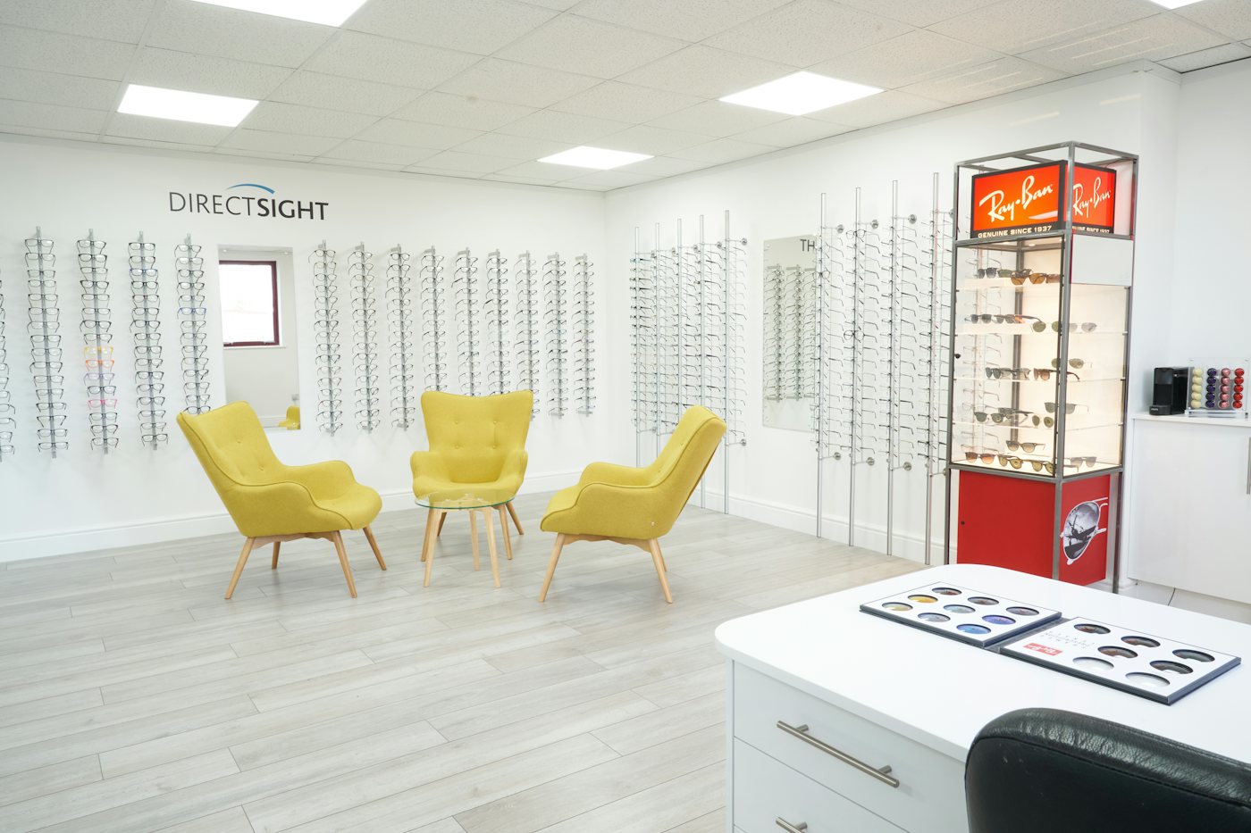 Image of Direct Sights shop with rows of glasses on the wall