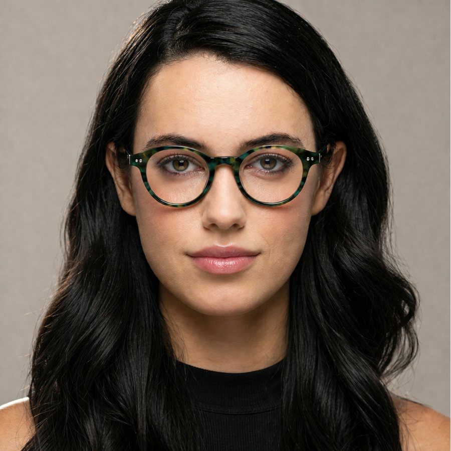 Woman wearing a round plastic multi coloured frame