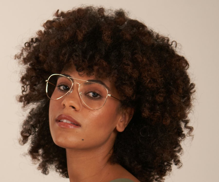 Woman wearing an aviator gold metal frame