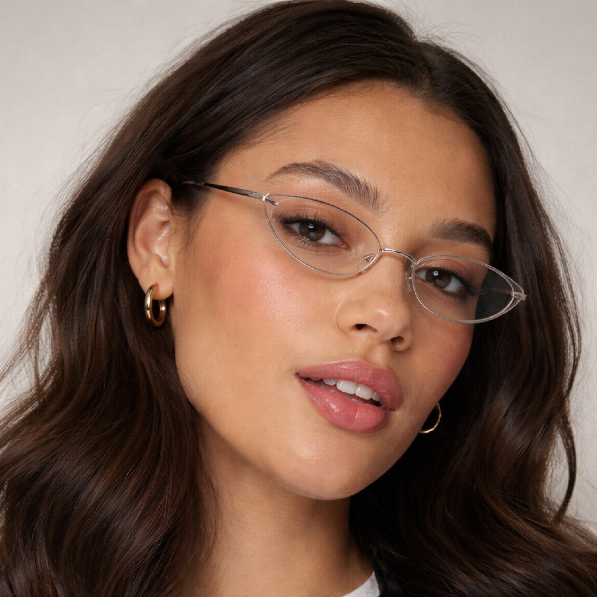 Woman wearing cat eye shaped rimless glasses Bayonetta glasses