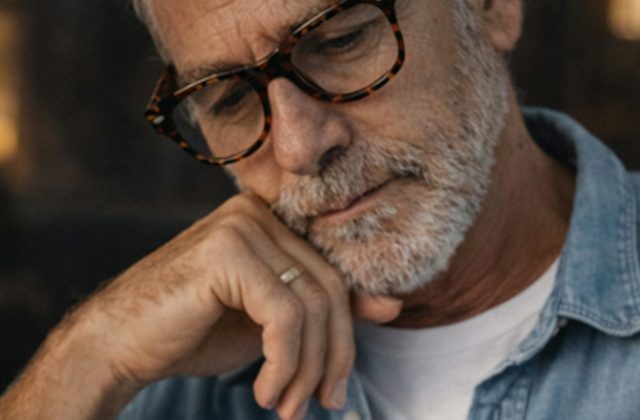Older attractive man wearing varifocal glasses