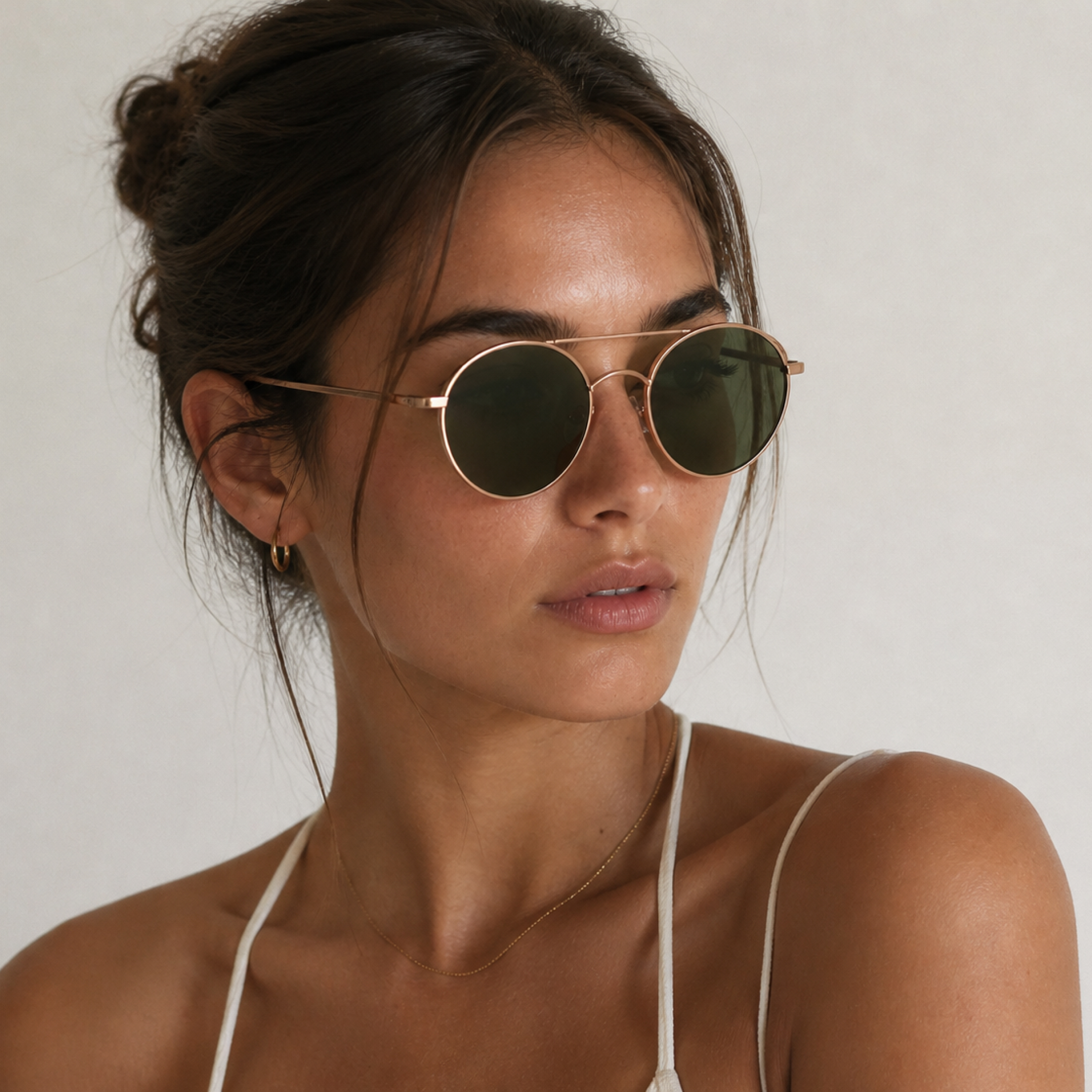Woman wearing sunglasses with green tinted lenses