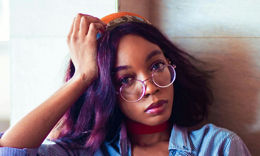 Lady wearing round metal glasses