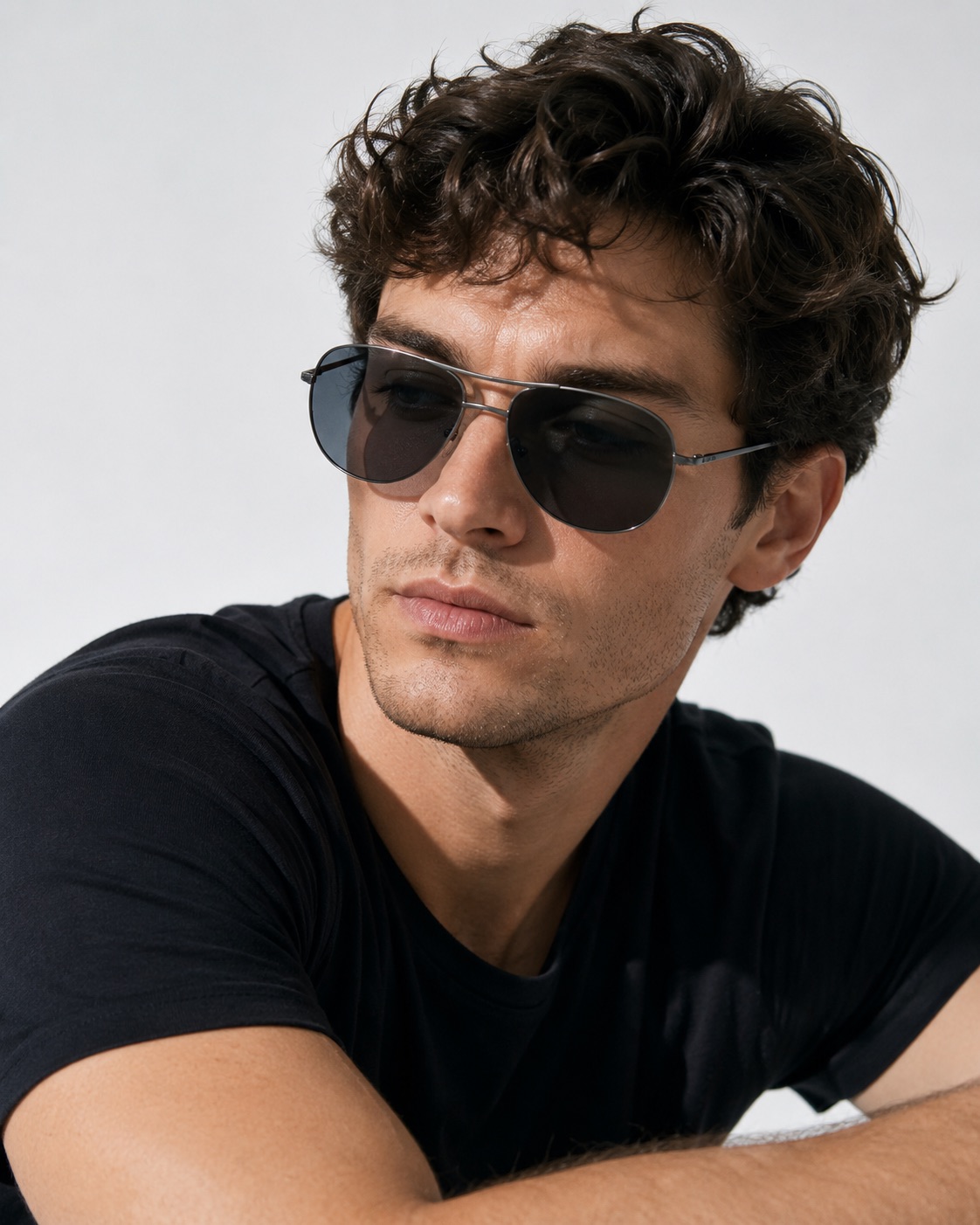 man wearing aviator style gun metal sunglasses with grey lenses
