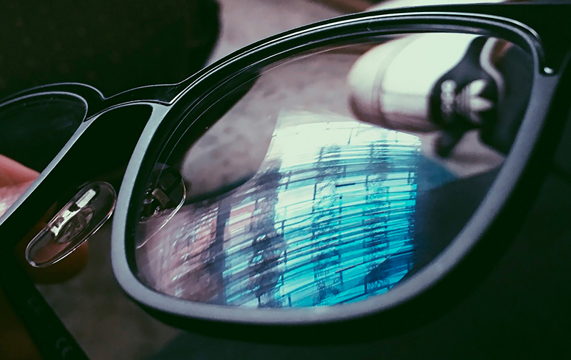 Close up of eye glasses showing reflection on the lenses
