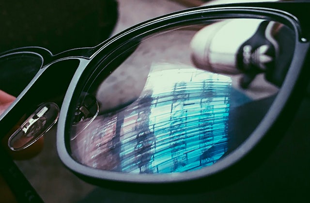 Close up of eye glasses showing reflection on the lenses