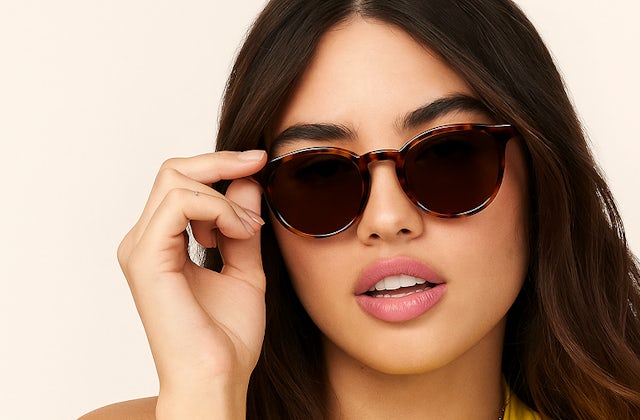 Woman wearing round havana sunglasses