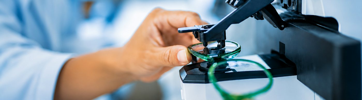 A green glasses frame in a focimeter having the lens prescription checked