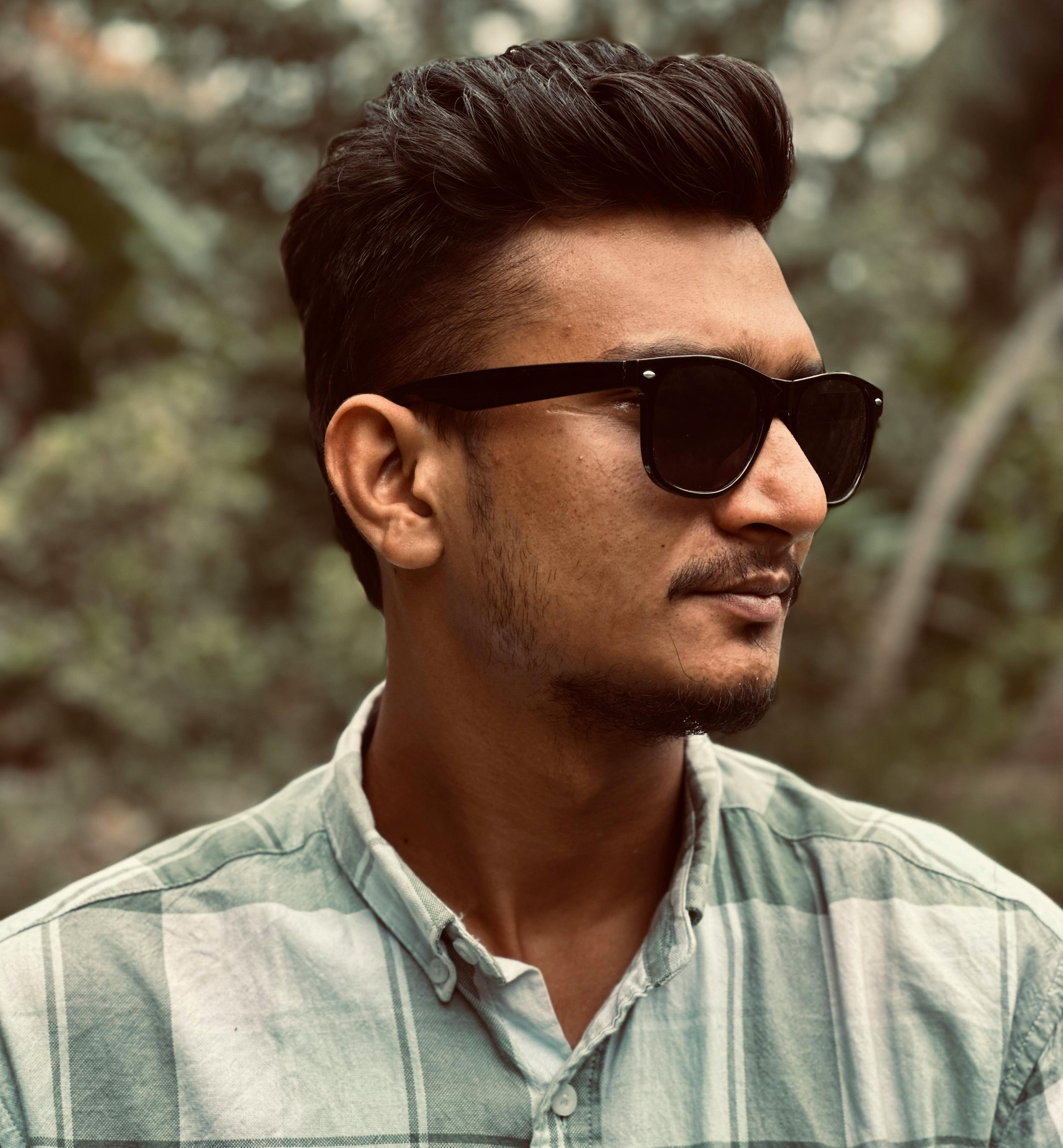 Man wearing a wayfarer style sunglasses frame