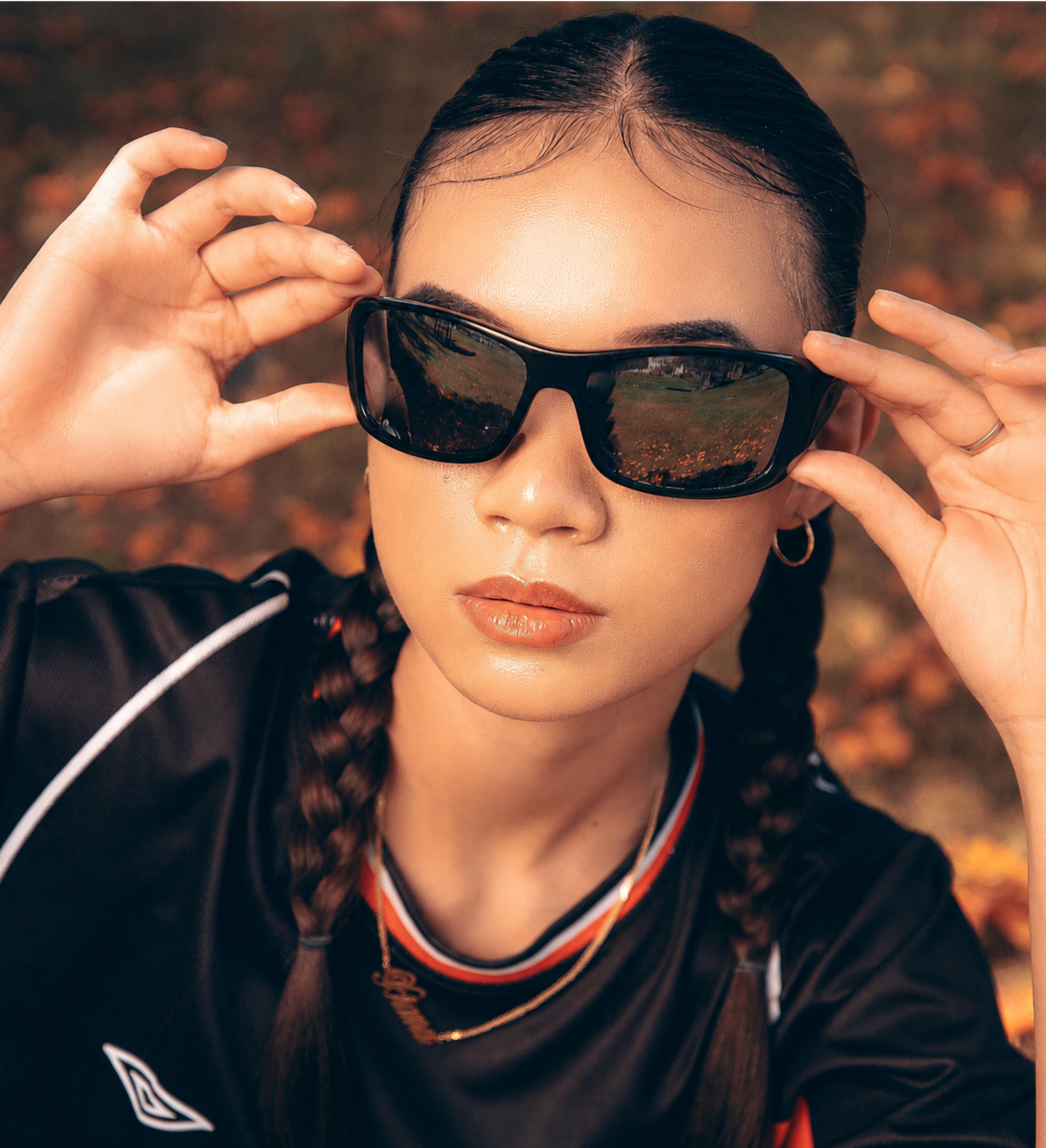 Woman wearing wrap around black sunglasses
