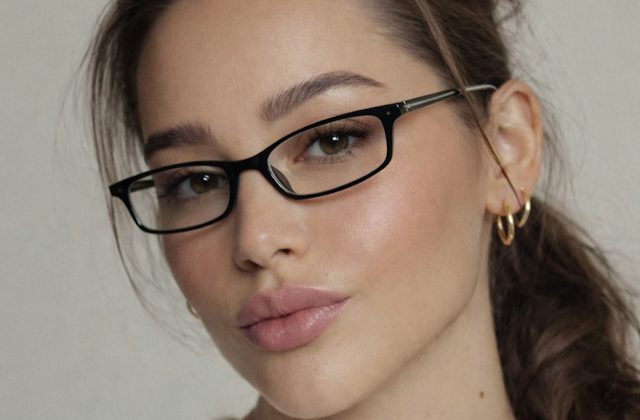 Woman wearing narrow black plastic glasses