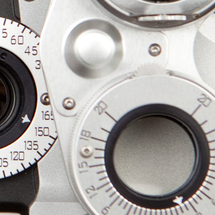 close up on eye examining machine