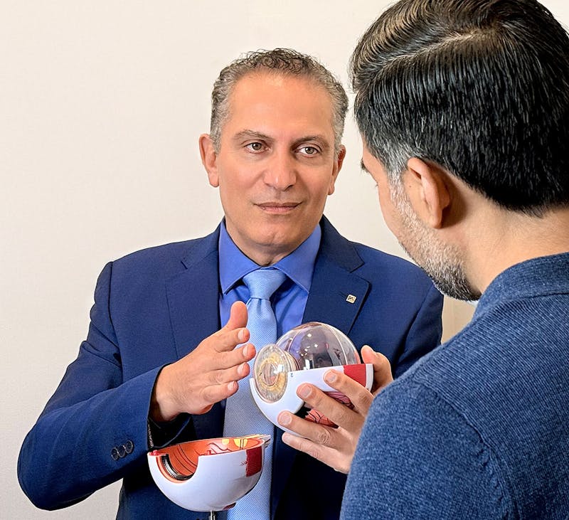 Dr. Cohen showing inner eye example to patient