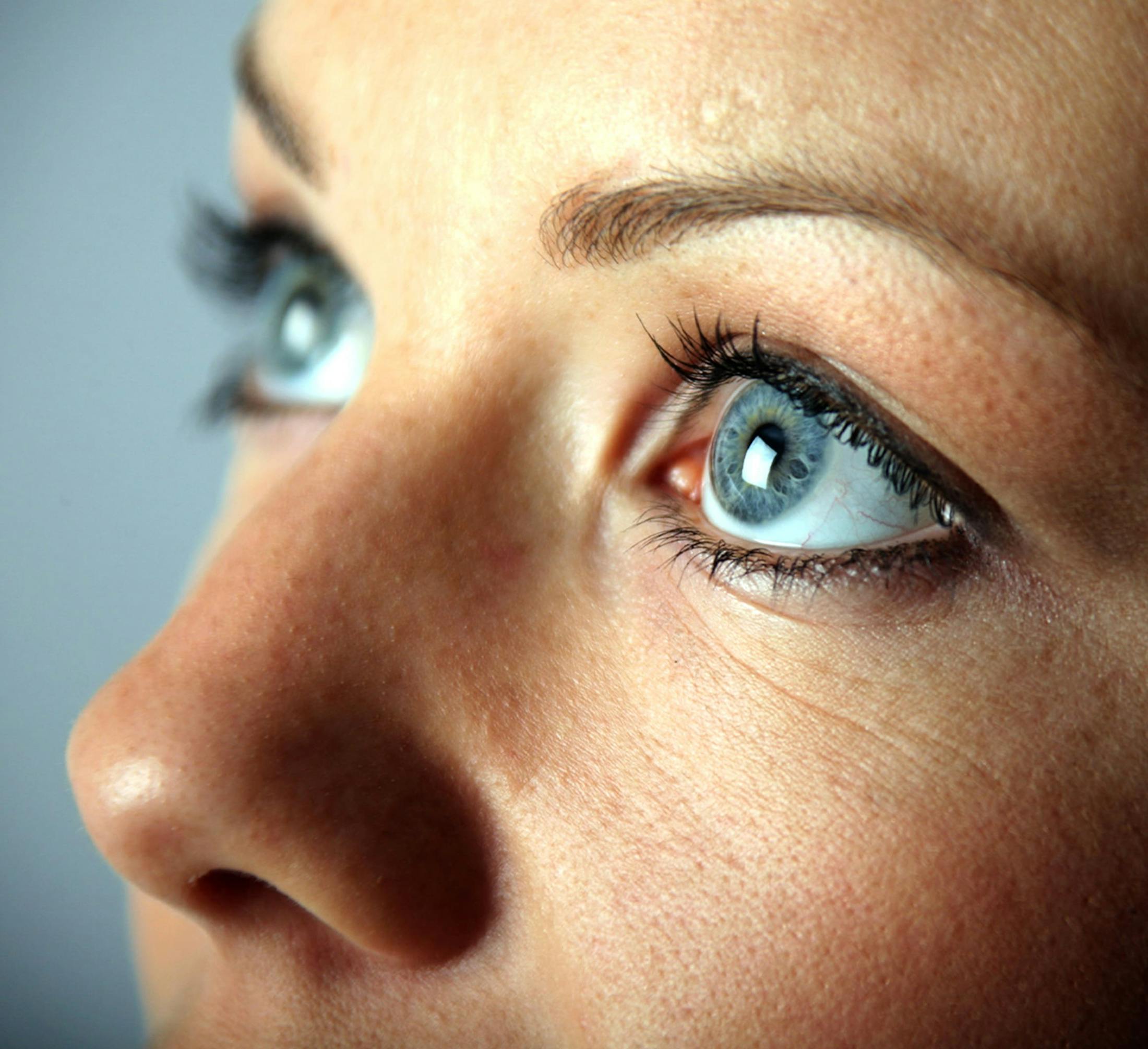 close up on a woman looking upwards