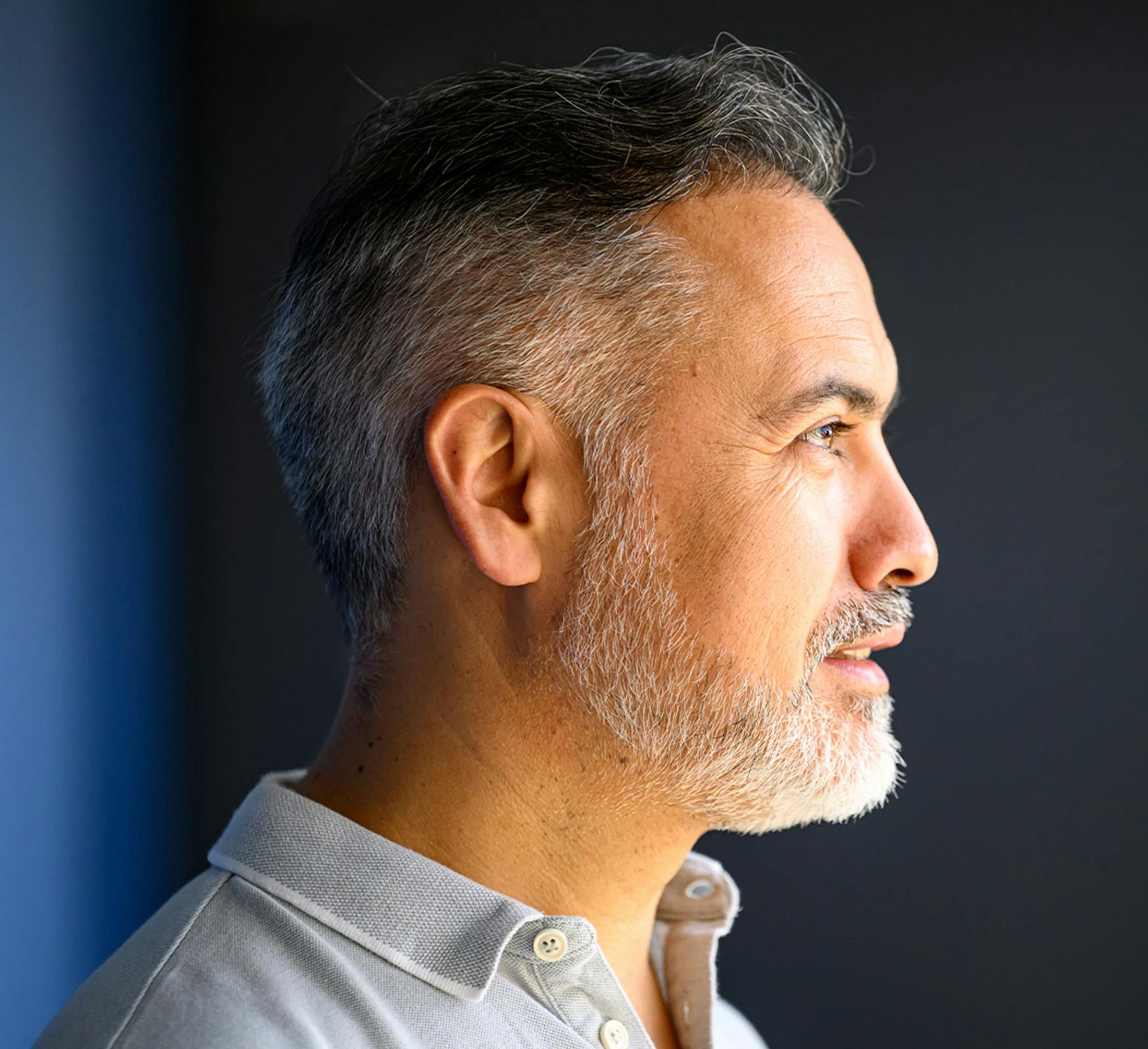 Profile of a man smiling