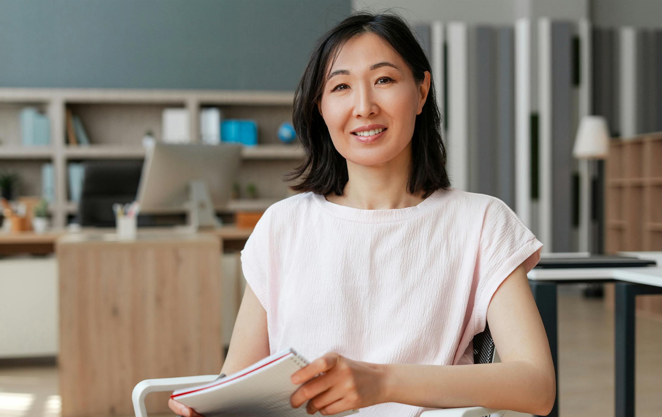 woman wearing a light pink top