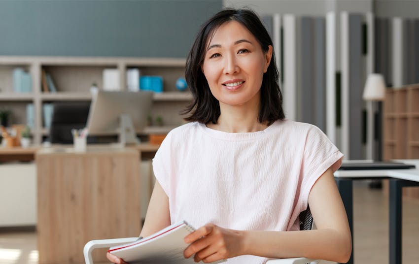 woman wearing a light pink top